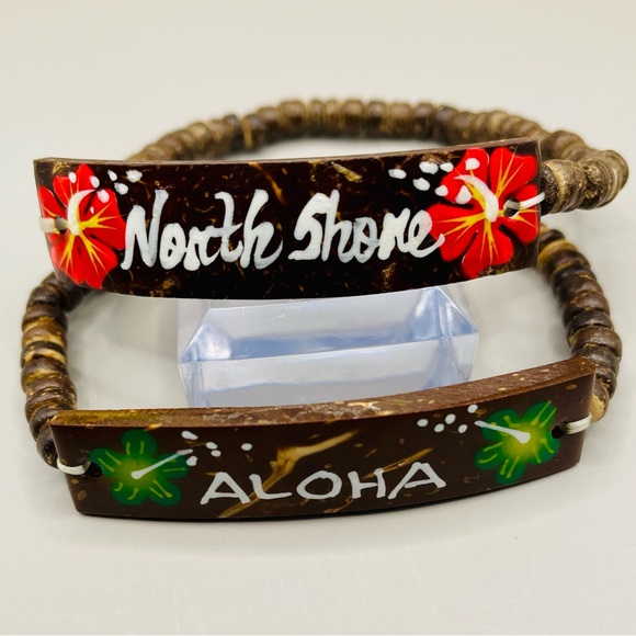 Two Hawaiian coconut shell bracelets. One saying Aloha and one North Shore. - Picture 2 of 6